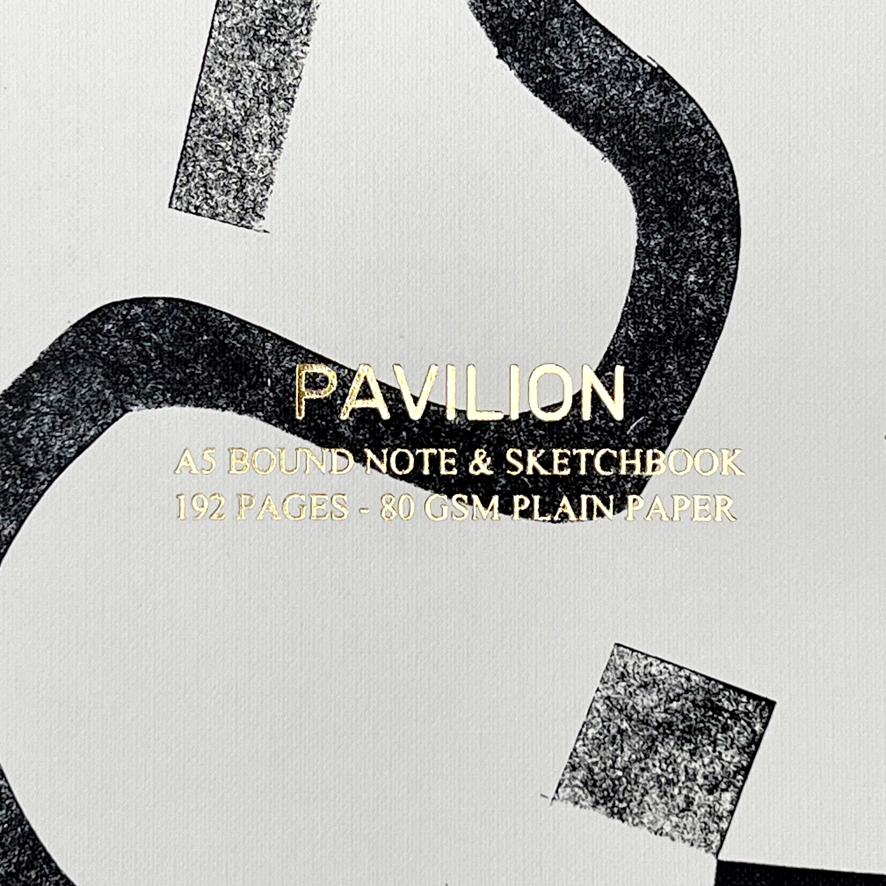 Close-up of Bass A5 notebook showing the monochrome abstract design, gold foil detail and buckram embossed cover.