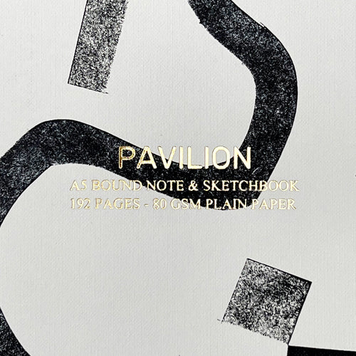 Close-up of Bass A5 notebook showing the monochrome abstract design, gold foil detail and buckram embossed cover.