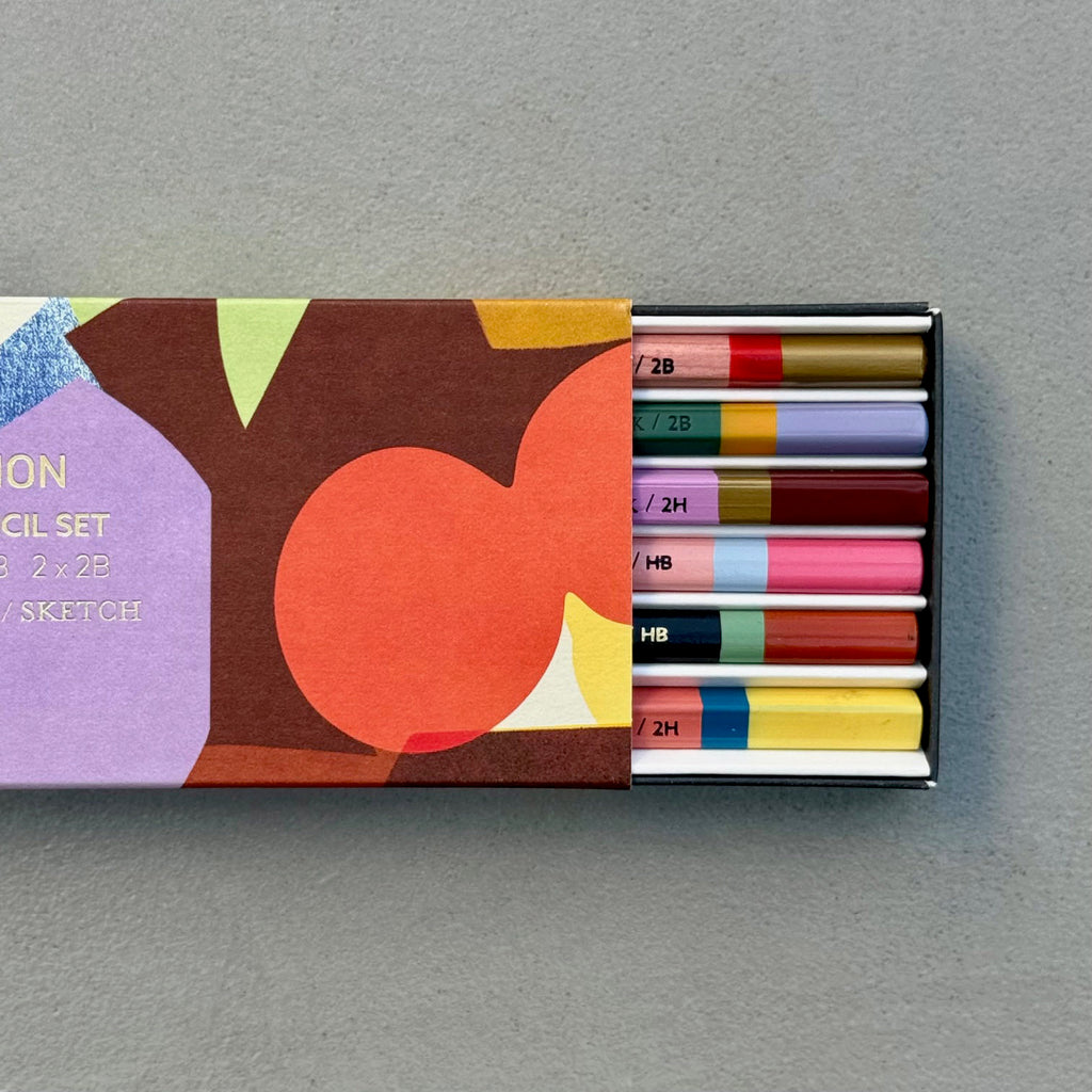 Assemblage Pencil Set with abstract patterned sleeve partially open to reveal six graphite pencils