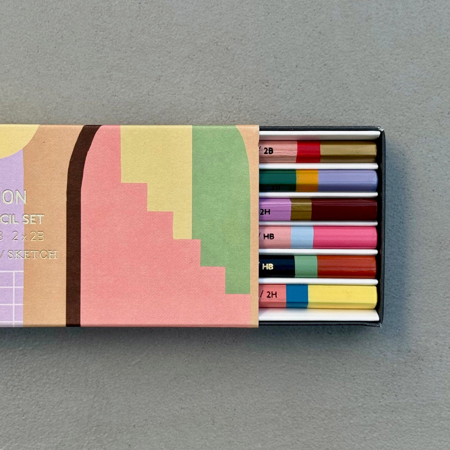 Casa Pencil Set with patterned sleeve partially open to reveal six graphite pencils