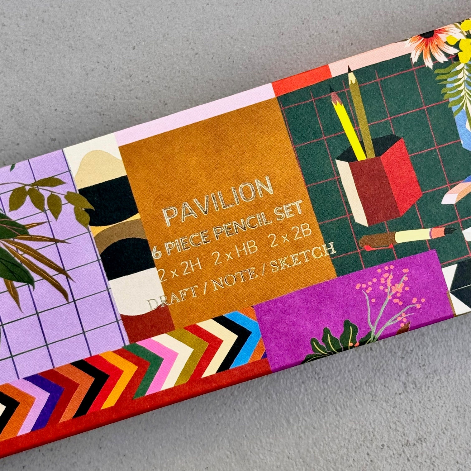 Close-up of Lifestyle Pencil Set illustrated box design with gold foil lettering