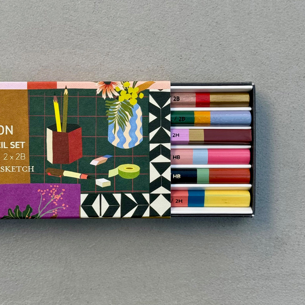 Lifestyle Pencil Set with illustrated sleeve partially open to reveal six graphite pencils