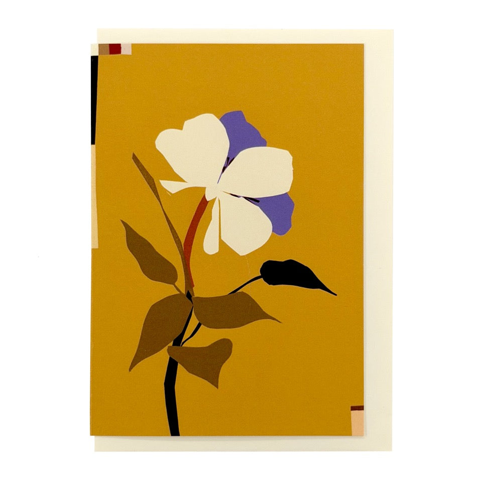 Greeting card featuring an illustrated anemone flower on a golden ochre background with a cream envelope.
