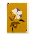 Greeting card featuring an illustrated anemone flower on a golden ochre background with a cream envelope.
