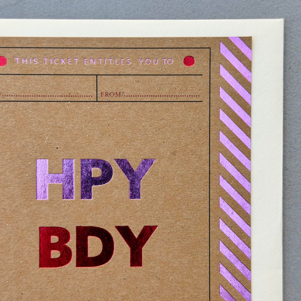 Close-up of the Birthday Ticket card highlighting the kraft card stock, vibrant foil lettering and ticket-inspired graphic details.