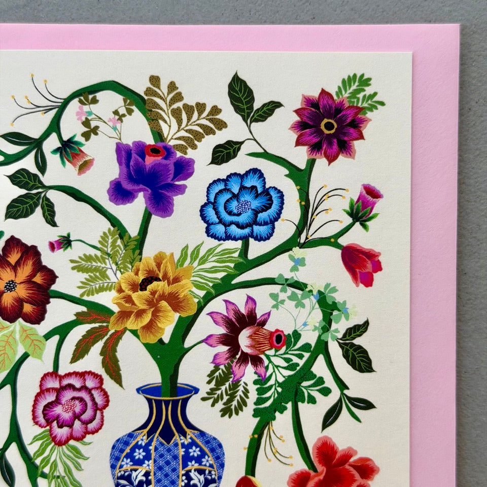 Close-up of the Blue Vase design highlighting the ornate blue vase, vibrant flowers and intricate botanical illustration on a cream background.
