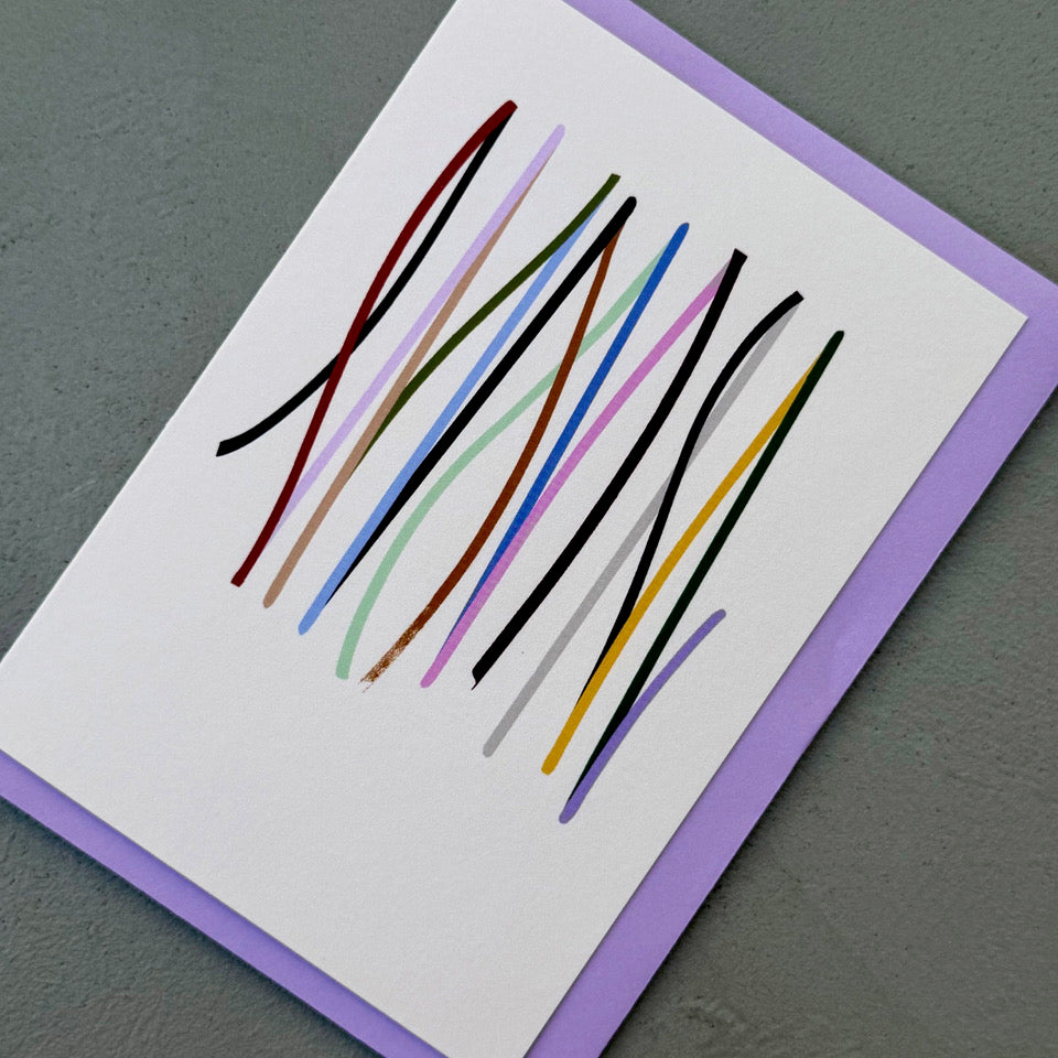 Angled view of the off-white Cadence card with multicoloured vertical lines.