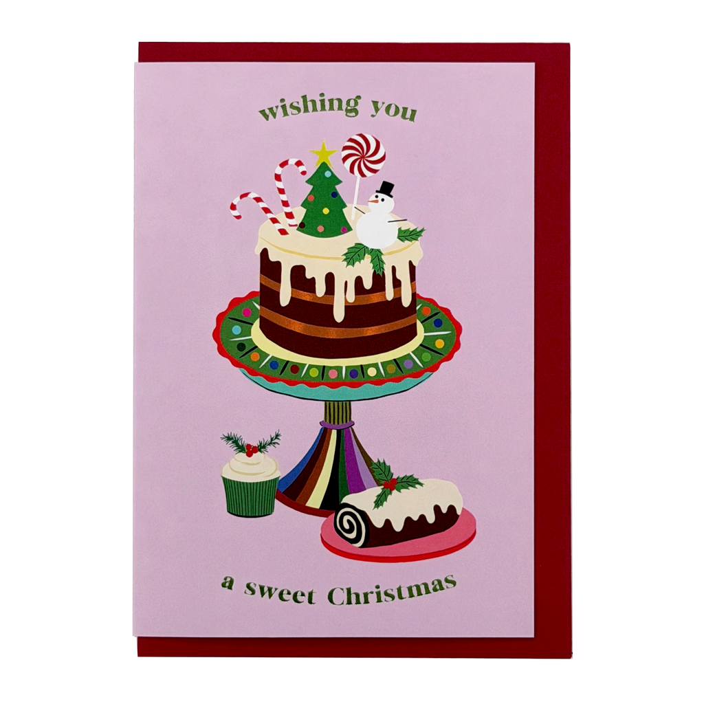 Cake Christmas card by PAVILION with festive cake, snowman, candy canes and red envelope