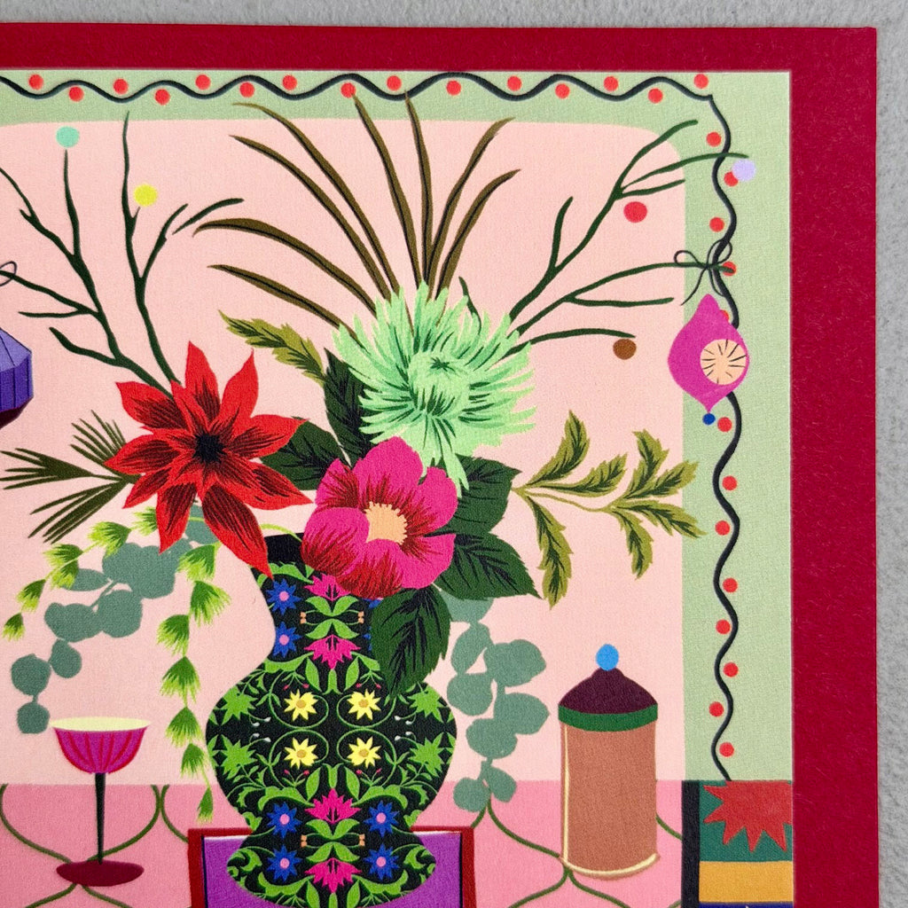 Detail of Christmas Cracker card showing illustrated flowers, ornaments and patterned border