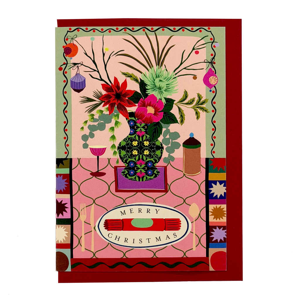 Christmas Cracker card with colourful festive tablescape, flowers and red envelope