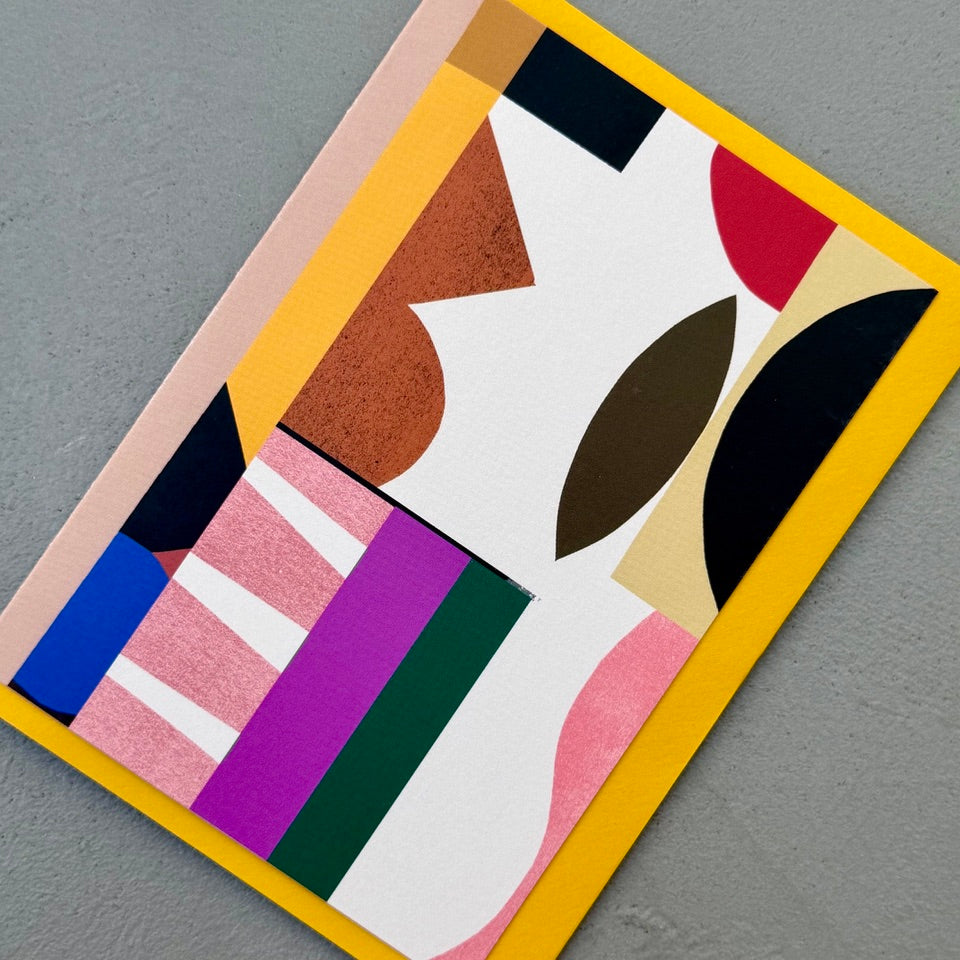 Angled view of the Composition No.2 abstract geometric greeting card with a mustard yellow envelope.
