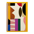 Abstract geometric greeting card featuring bold modern shapes in cream, mustard, brown, pink, plum, green, blue and black, paired with a mustard yellow envelope.