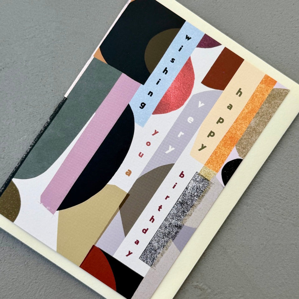 Angled view of the Contemporary Happy Birthday greeting card with a cream envelope, highlighting the bold abstract composition and contemporary design.