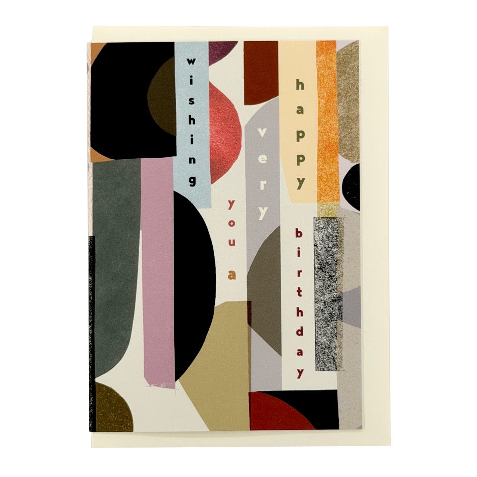 Contemporary birthday card with layered abstract shapes and vertical typography spelling "Wishing You a Very Happy Birthday", paired with a cream envelope.