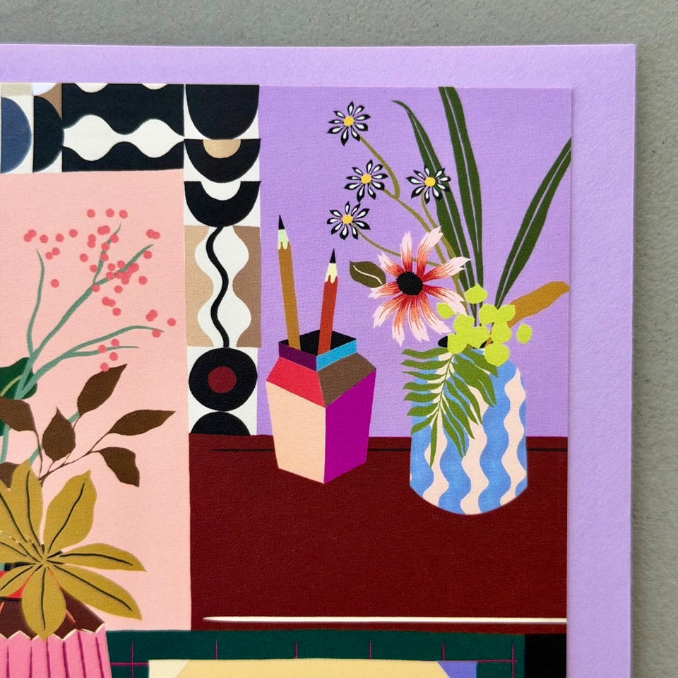 Close-up of the illustrated vase of flowers and stationery on the Creative Corner greeting card.
