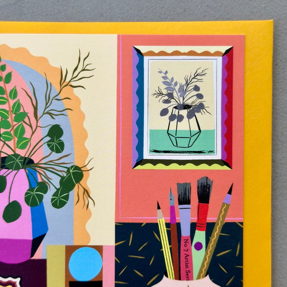 Close-up of the illustrated artwork, paintbrushes and decorative details on the Creative Interior greeting card.