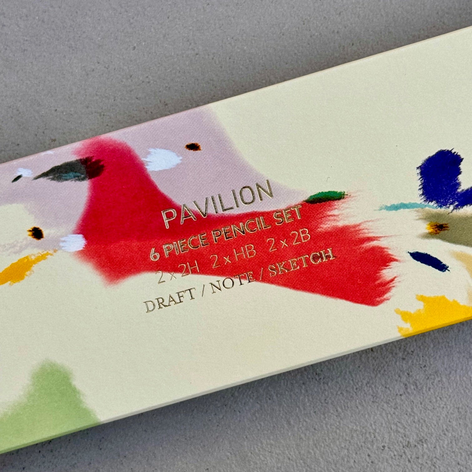 Close-up of gold foil detail on Galaxy pencil set packaging