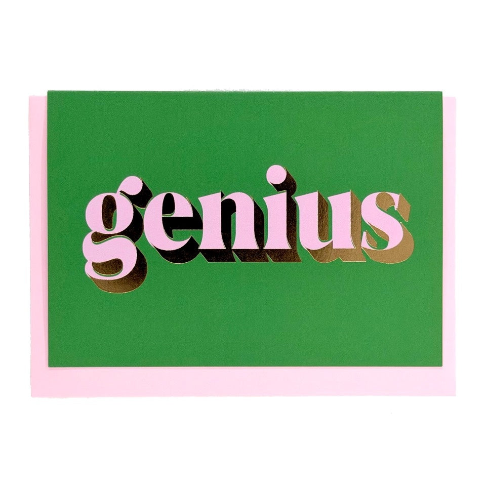 Green Genius card with lilac lettering and gold foil detail, shown with a pink envelope.