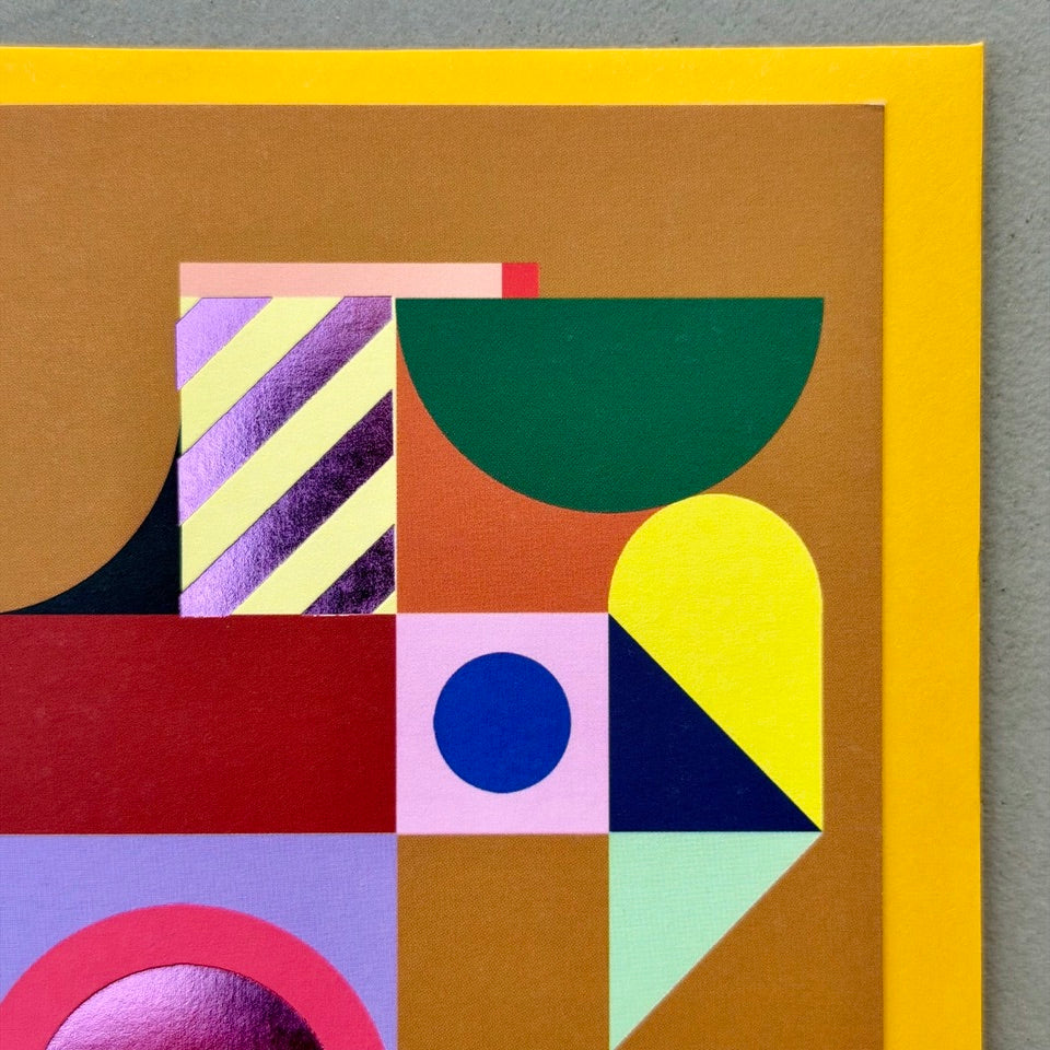 Close-up of the Geometric Abstract No.2 design highlighting layered geometric forms, vibrant colours and purple foil accents.
