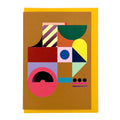 Modern abstract geometric greeting card featuring bold colourful shapes with purple foil details on a warm ochre background, paired with a mustard yellow envelope.