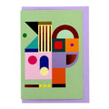 Modern abstract geometric greeting card featuring colourful shapes in mint green, lavender, coral, blue and gold foil, paired with a lavender envelope.
