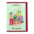 Gifts Christmas card by PAVILION with stacked wrapped presents, candy canes, baubles and the message “sending love this Christmas”