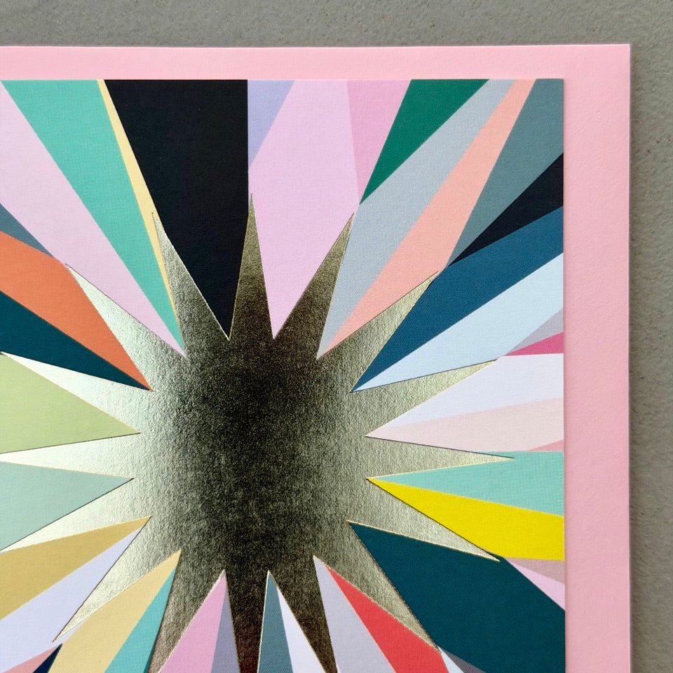 Close-up of the gold foil starburst and colourful geometric rays on the Gold Foil Starburst Card.