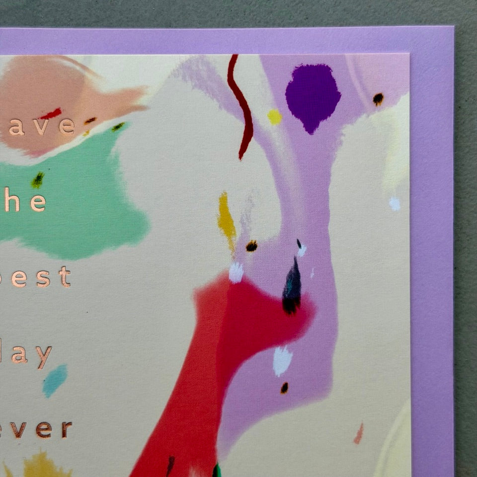 Close-up of the abstract painted artwork and embossed "Have the Best Day Ever" lettering on the Graphic Expression 05 card.
