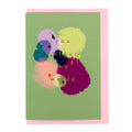 You Colour My World greeting card featuring abstract painterly colour blooms, shown with a pale pink envelope.