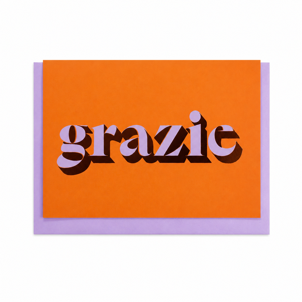 Orange Grazie card with lilac lettering and copper foil detail, shown with a lilac envelope.