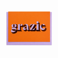 Orange Grazie card with lilac lettering and copper foil detail, shown with a lilac envelope.