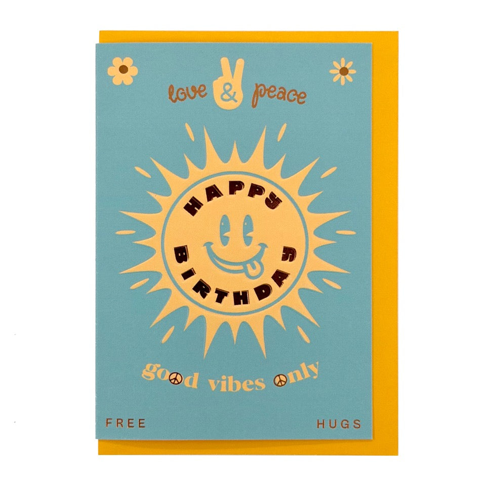 Foil-embellished birthday card featuring a smiling sun, "Happy Birthday" lettering and the message "Good Vibes Only", paired with a bright yellow envelope.