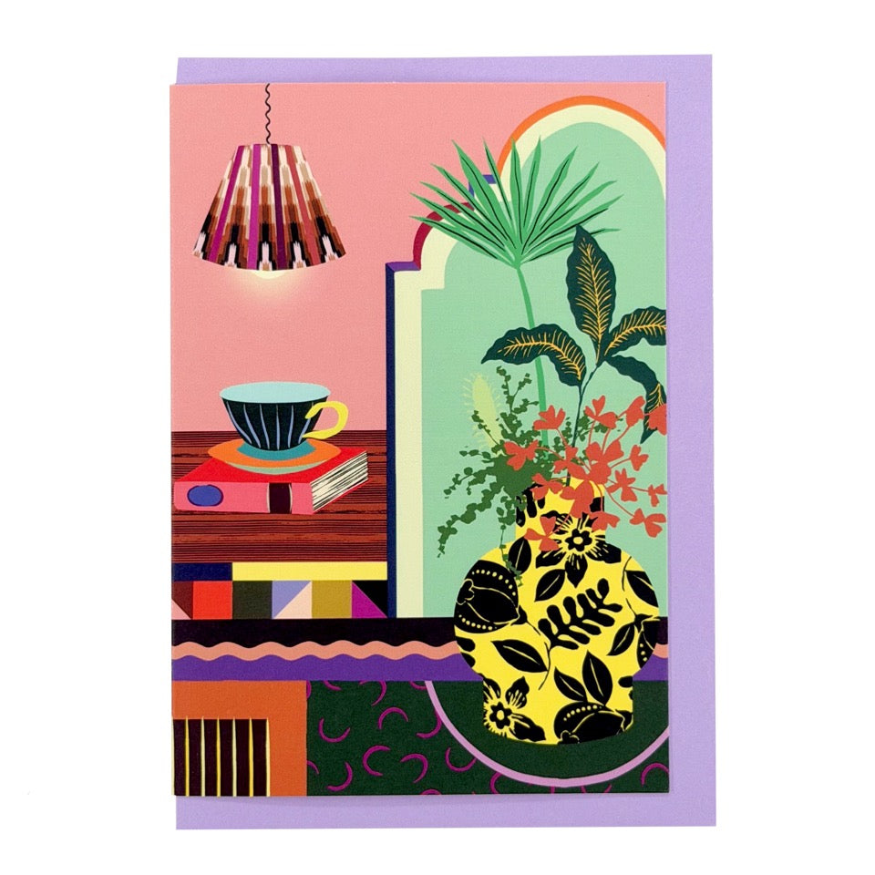 Greeting card featuring an illustrated home interior with houseplants, a patterned vase and a cup of coffee on a lilac envelope.