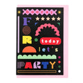Bold typographic greeting card reading "Hooray For Today Let's Party" in colourful geometric lettering on a black background with a pale pink envelope.