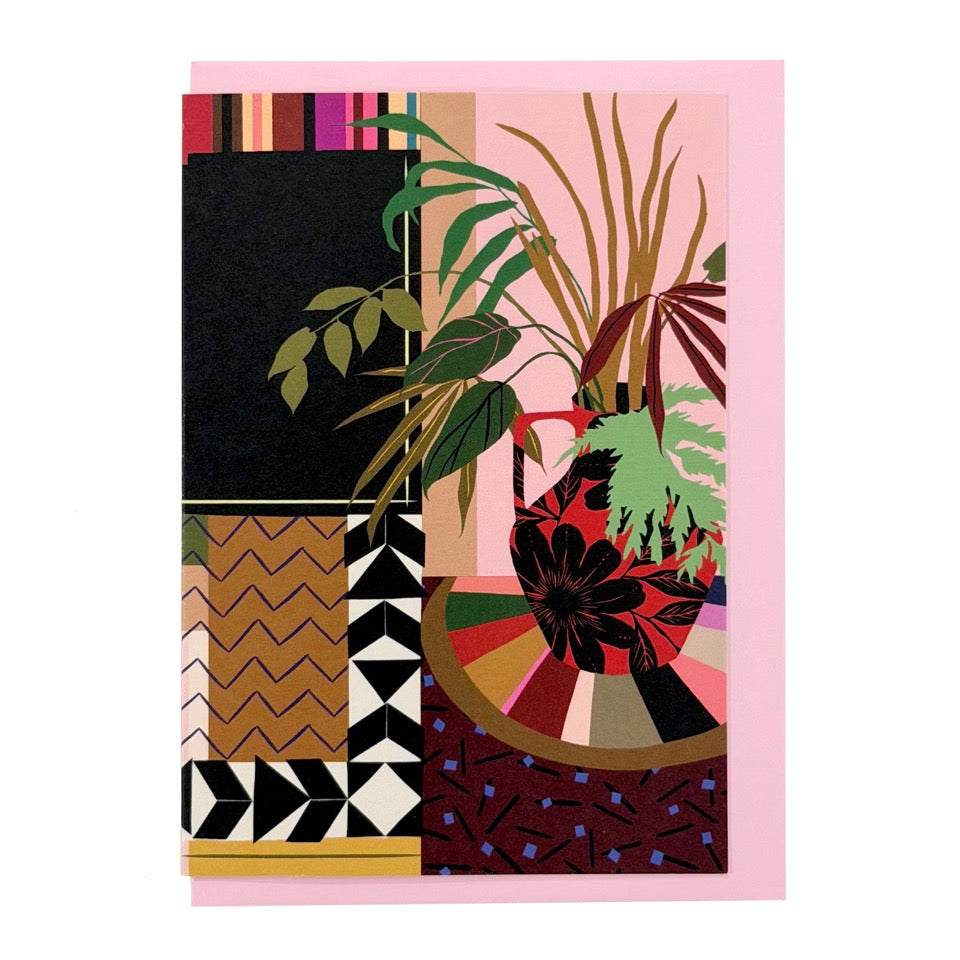 Greeting card featuring an illustrated interior with houseplants and patterned décor on a pink envelope.