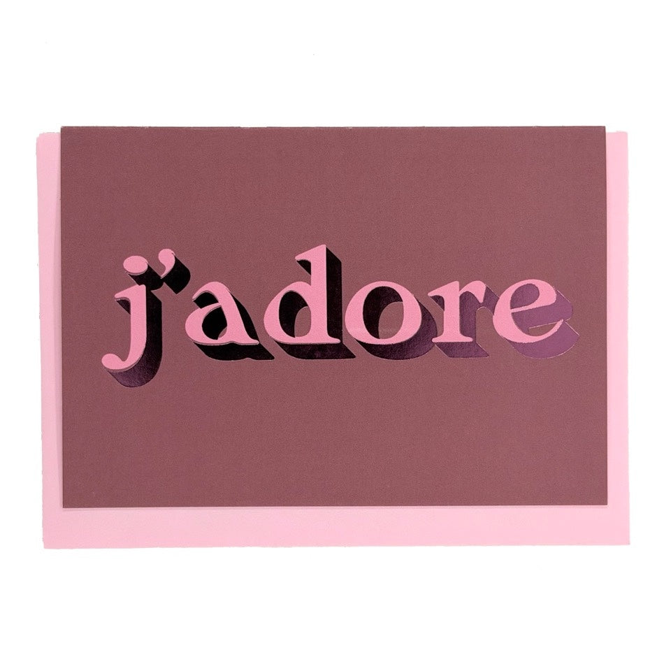 Mauve J’adore card with pink lettering and metallic pink foil detail, shown with a pink envelope.