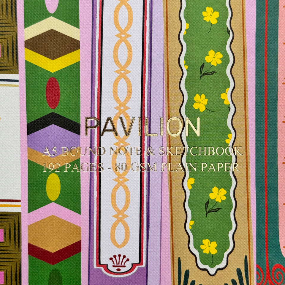 Close-up of Library A5 notebook cover with gold foil lettering and illustrated book spines
