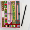 Library A5 notebook with colourful illustrated book spine cover and black pencil