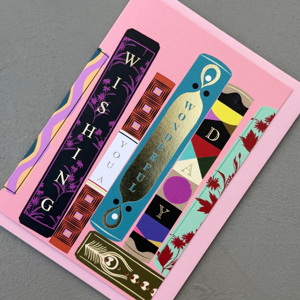 Angled view of the Library Collection 01 greeting card with its pale pink envelope.
