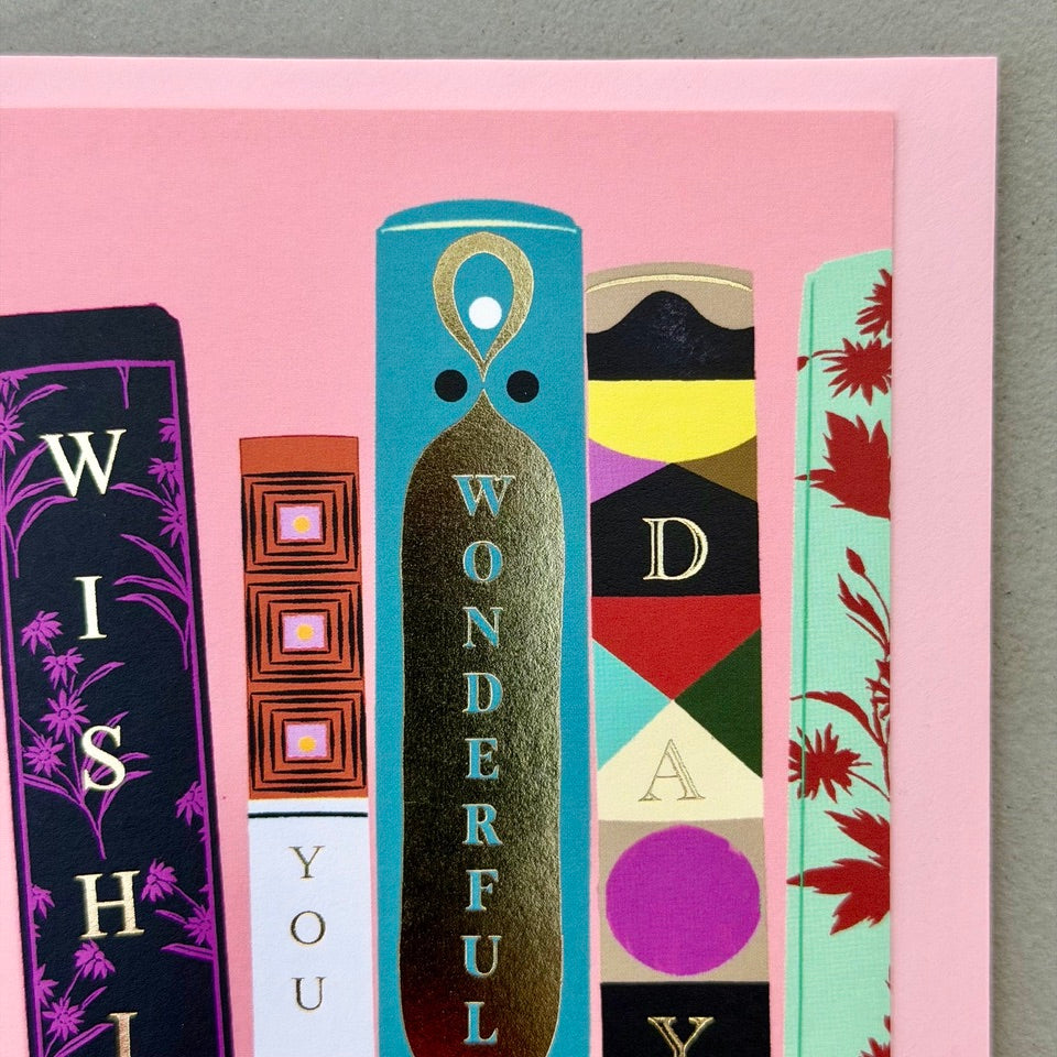 Close-up of the illustrated bookshelf and decorative book spines spelling "Wishing You a Wonderful Day" on the Library Collection 01 card.
