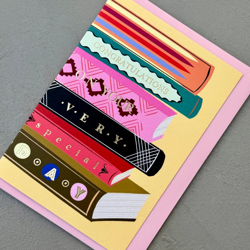 Angled view of the Library Collection 03 greeting card with its pale pink envelope.