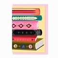 Library Collection 03 greeting card featuring a stack of illustrated books spelling "Congratulations on your very special day", shown with a pale pink envelope.