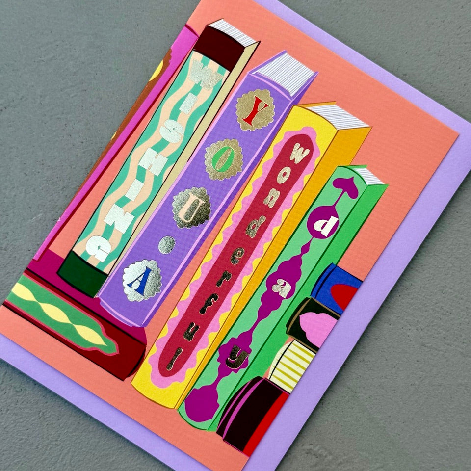 Angled view of the Library Collection 13 greeting card with its lavender envelope.
