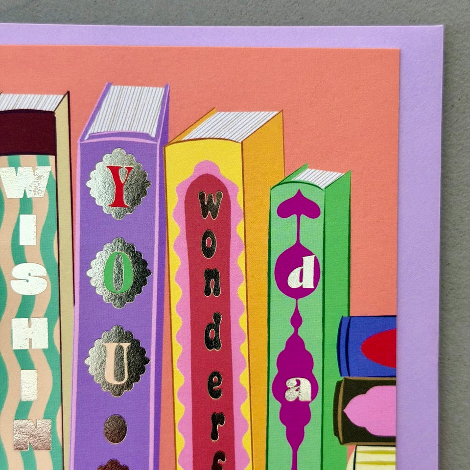 Close-up of the illustrated book spines spelling "Wishing You a Wonderful Day" on the Library Collection 13 card.
