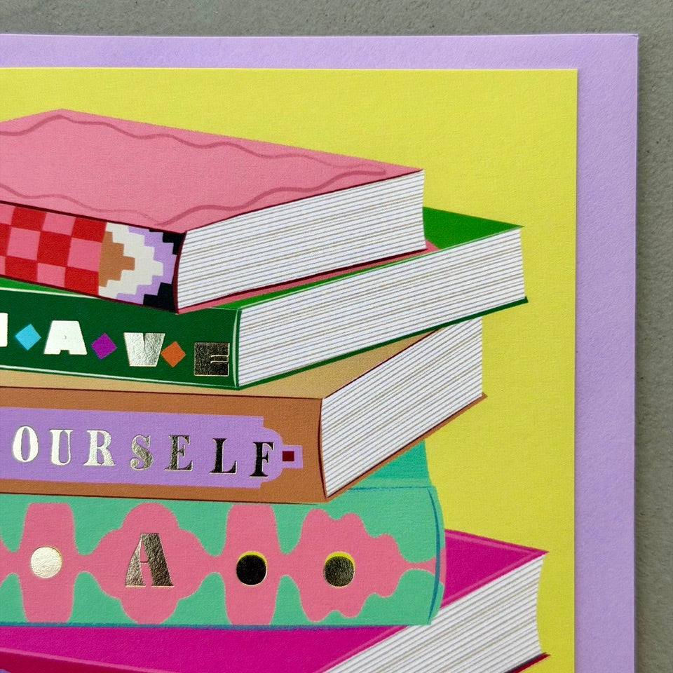 Close-up of the illustrated book stack spelling "Have Yourself a Fabulous Birthday" on the Library 