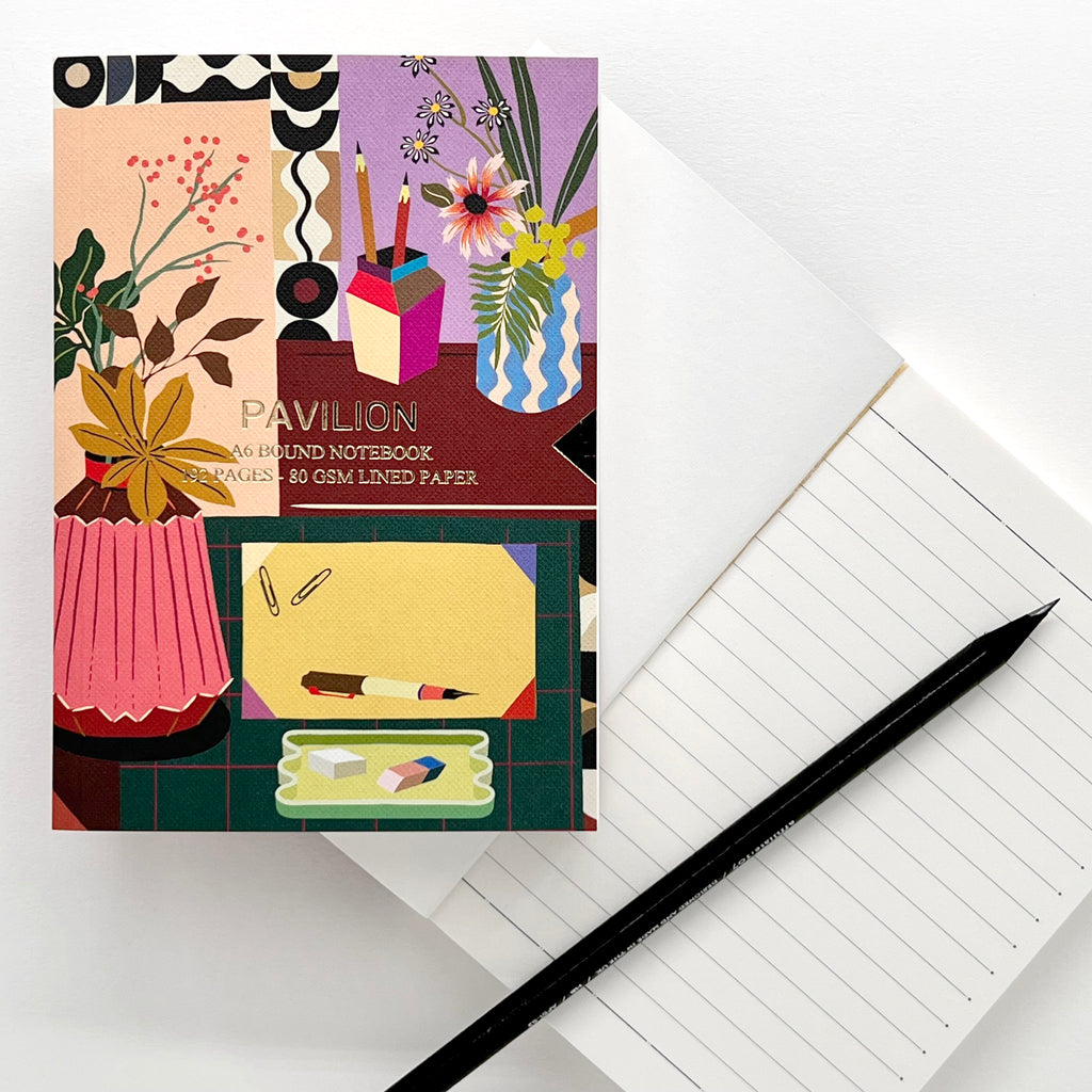 Lifestyle A6 Notebook with illustrated desk design and lined pages