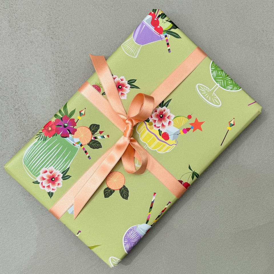 Wrapped gift in Mixology wrapping paper with peach ribbon