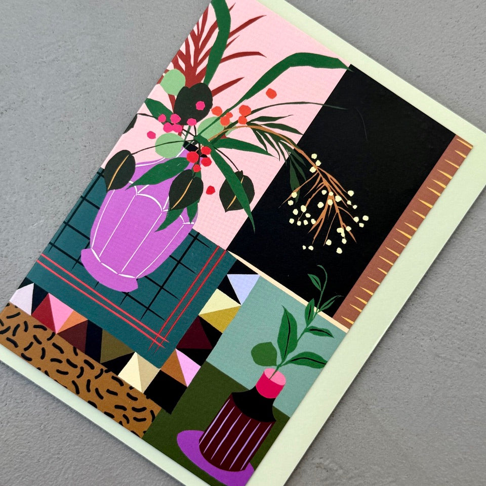 Angled view of the Modern Interior greeting card on a pale green envelope.