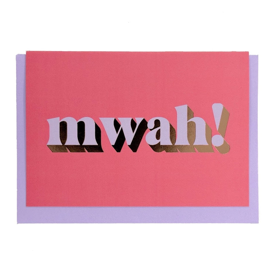 Bright pink Mwah! card with lilac lettering and gold foil detail, shown with a lilac envelope