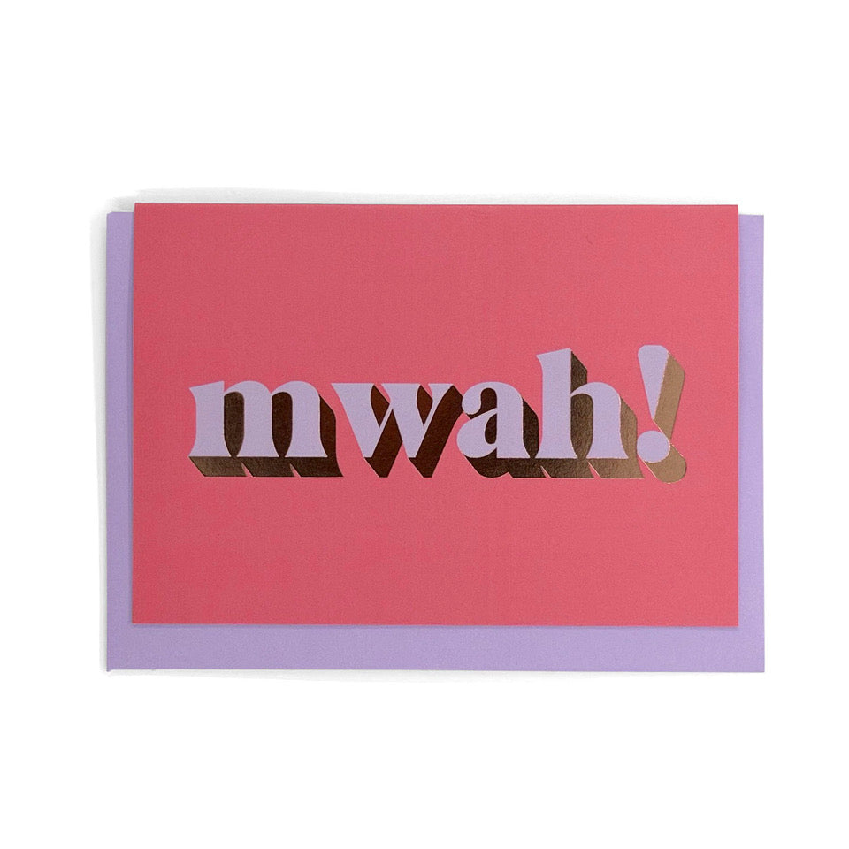 Bright pink Mwah! card with lilac lettering and gold foil detail, shown with a lilac envelope